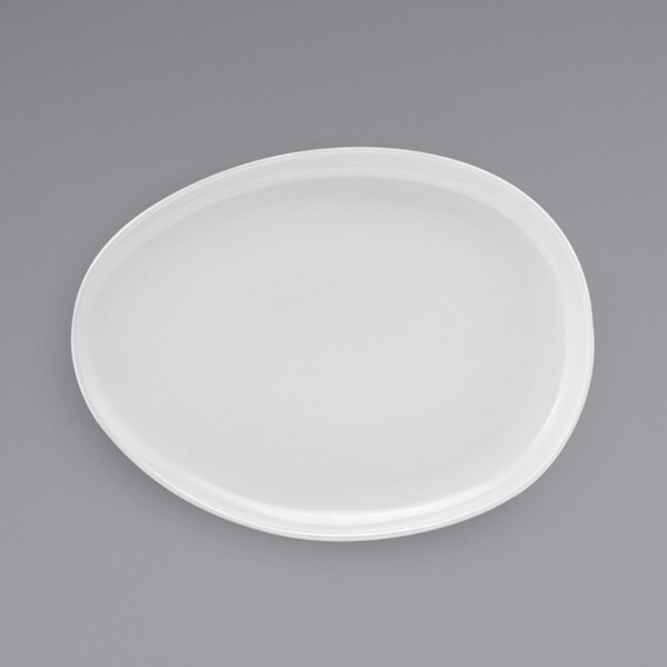 A white Front of the House Tides oval porcelain plate.