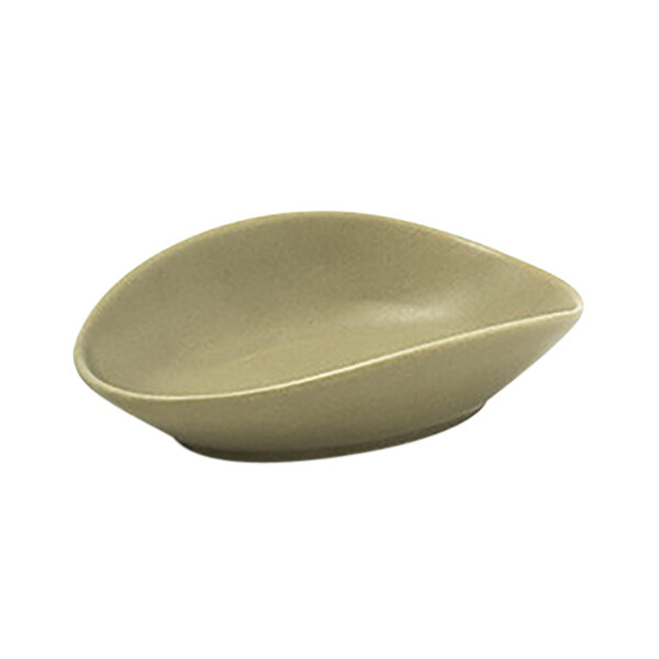 A Front of the House Tides sea grass oval ramekin with a curved edge.