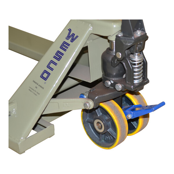 A Wesco Industrial Products pallet truck wheel.