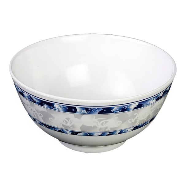 A white melamine rice bowl with blue and white dragon designs.