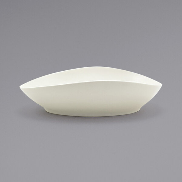 a white bowl with a curved edge