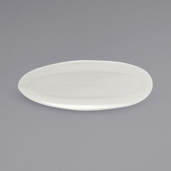 A white oval Front of the House Tides porcelain plate.