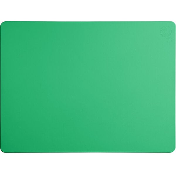 A green rectangular cutting board on a white surface.