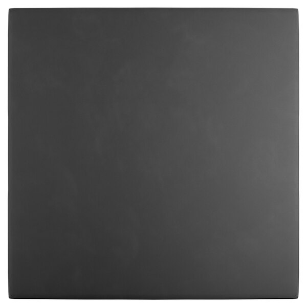 A black square object with a white border.