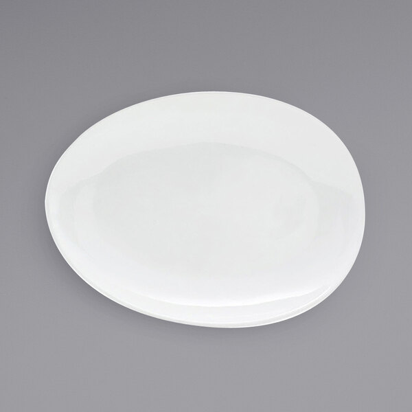 A white Front of the House Tides oval porcelain plate.