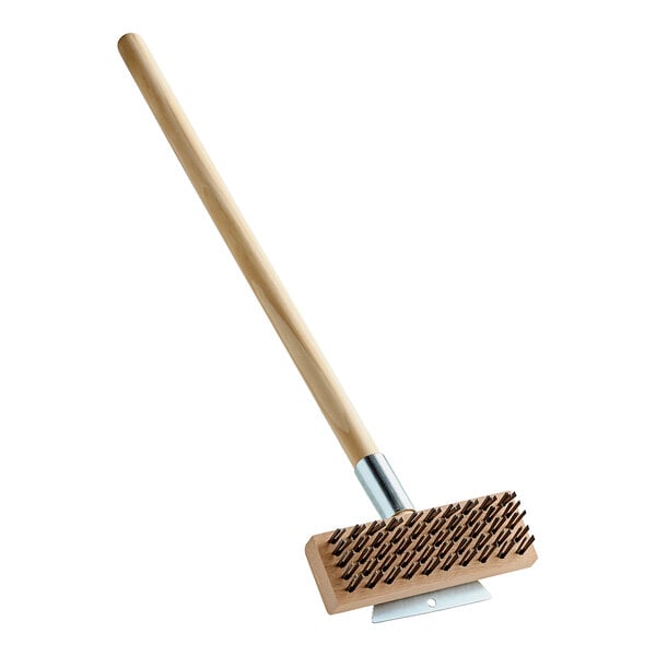 A Carlisle Sparta oven and grill brush with a wooden handle.