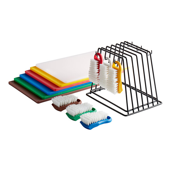 A rack with six color-coded cutting boards and six brushes.