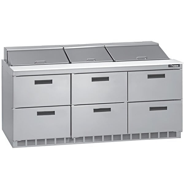 A stainless steel Delfield sandwich prep table with six drawers.
