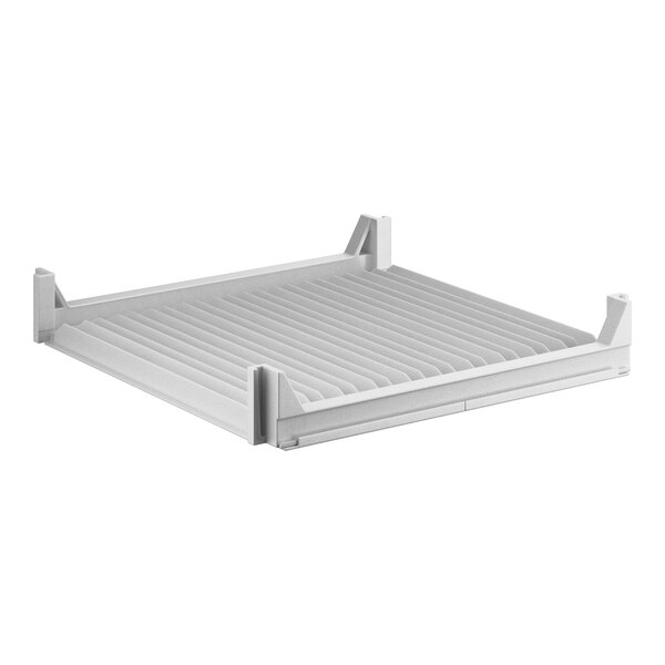 A white plastic shelf with slats.