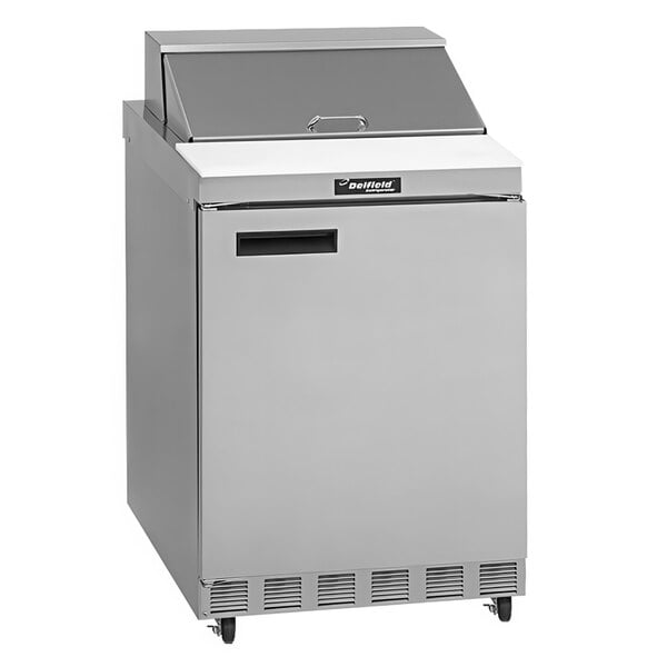 A stainless steel Delfield refrigerator for sandwich and salad preparation with a door.