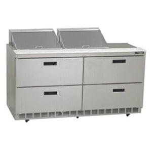 A Delfield stainless steel 4 drawer refrigerator on a kitchen counter.
