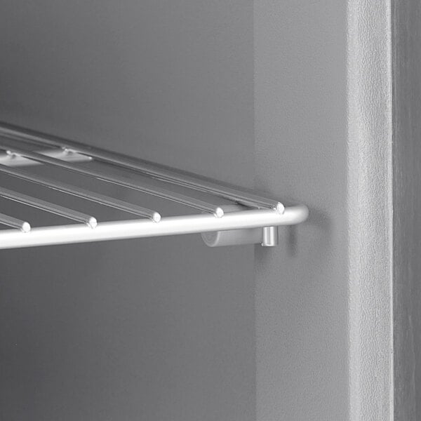 A metal shelf with a metal rack on it.