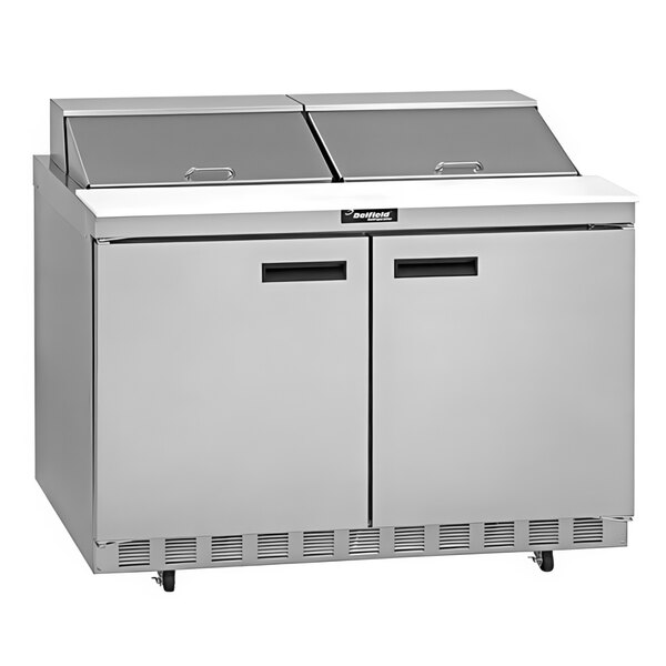 A Delfield stainless steel sandwich prep table with two doors on a counter.