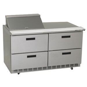 A stainless steel Delfield refrigerator with drawers on a counter.