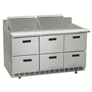 A Delfield stainless steel refrigerated sandwich prep table with drawers.