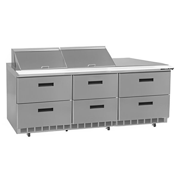 A stainless steel Delfield refrigerator with six drawers on a counter.