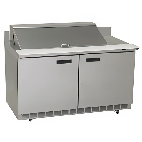 A Delfield stainless steel sandwich prep refrigerator with two doors and a mega top.