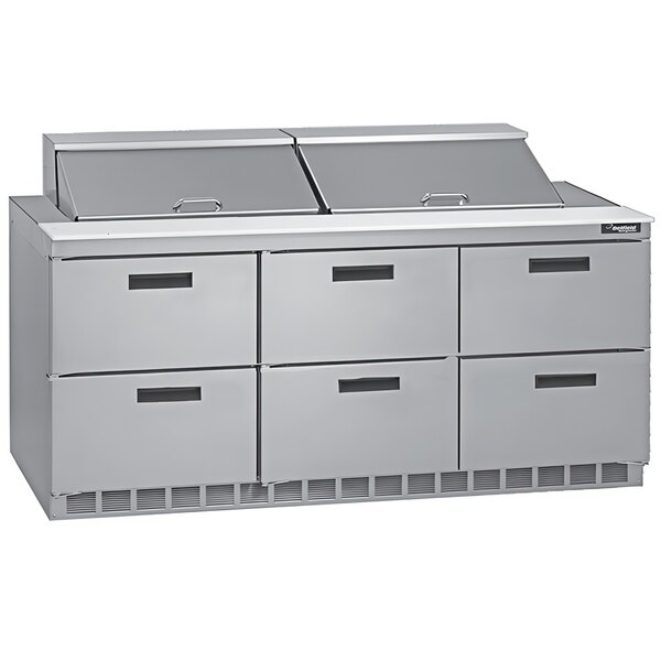 A stainless steel Delfield refrigerator with six drawers on a counter.