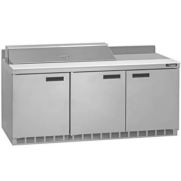 A white rectangular Delfield sandwich prep table with a stainless steel counter top.