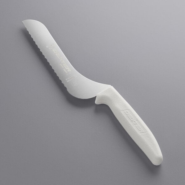 A white Dexter-Russell scalloped bread knife with a white handle.