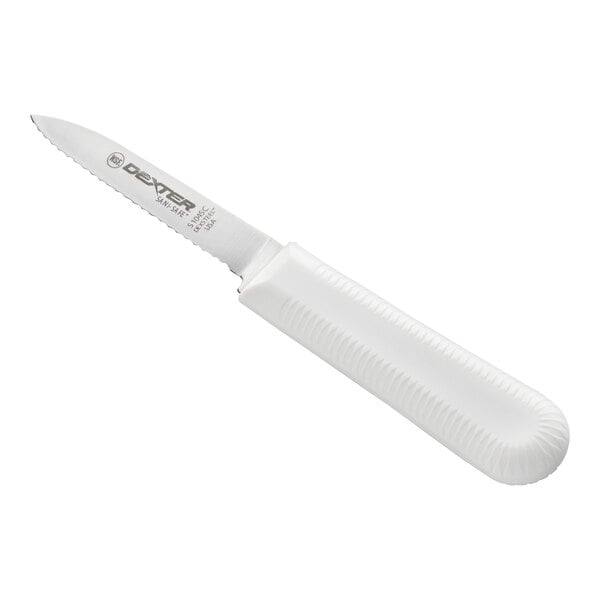 A small knife with a scalloped stainless steel blade and a textured white handle.