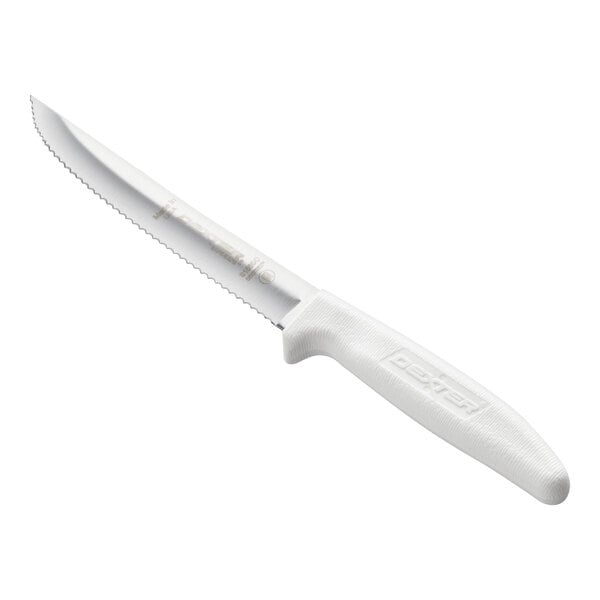 A serrated utility knife with a white textured handle and a scalloped stainless steel blade.