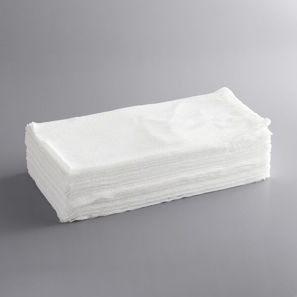 A stack of white San Jamar Grade 10 bleached cheesecloths.