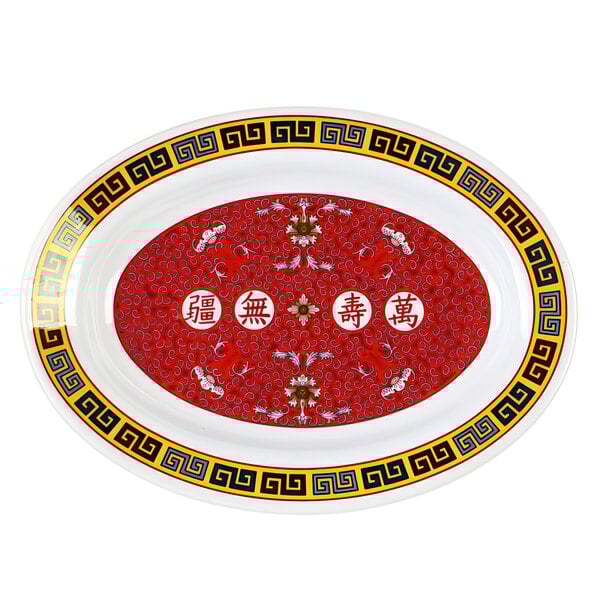 A red and white oval melamine platter with oriental writing in white.
