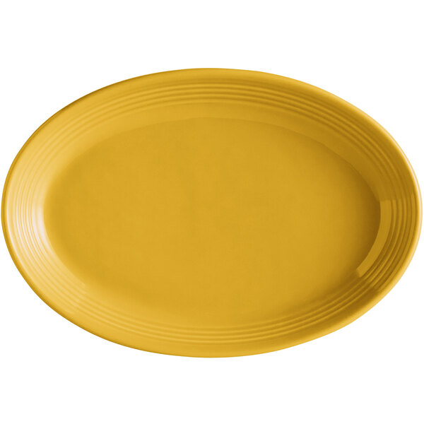 A yellow oval Tuxton china platter with a rim.