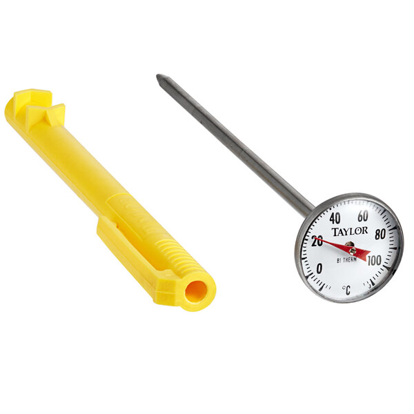 A yellow Taylor pocket probe dial thermometer on a counter.