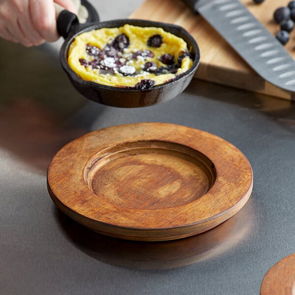 a wooden plate on a table