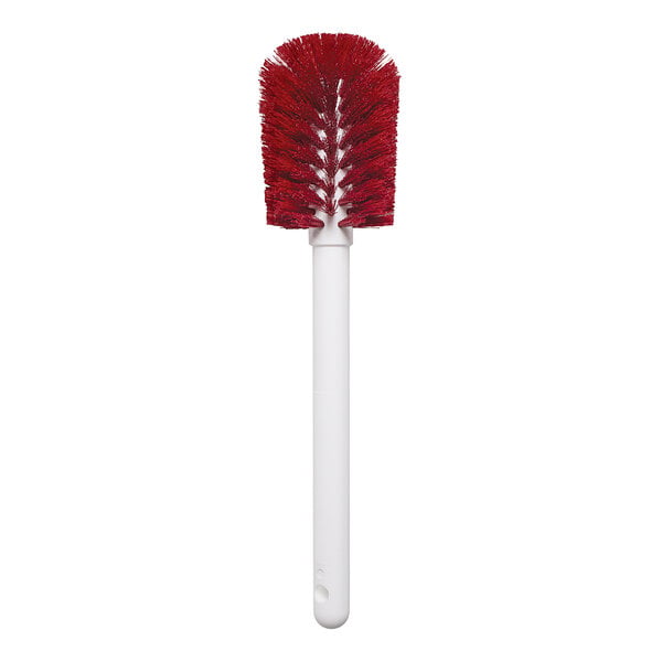 A white cylinder with a red and white brush inside.