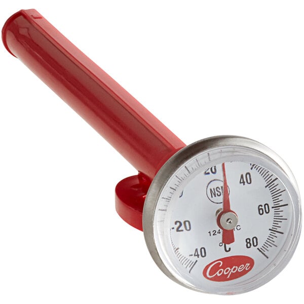 A red thermometer with a metal handle and a gauge.