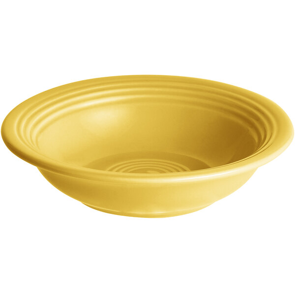 A yellow stoneware bowl with a rippled surface.