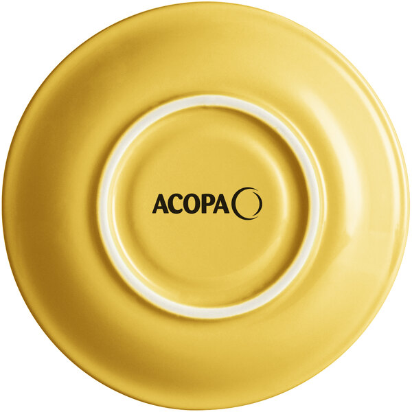 A yellow Acopa Capri stoneware saucer with black text that says "Acopa"