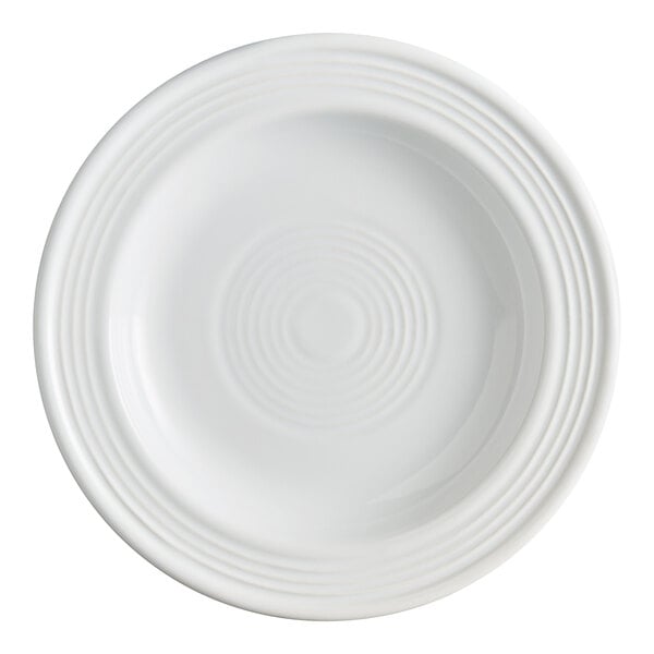 A white stoneware plate with a slightly raised rim and concentric circle design.