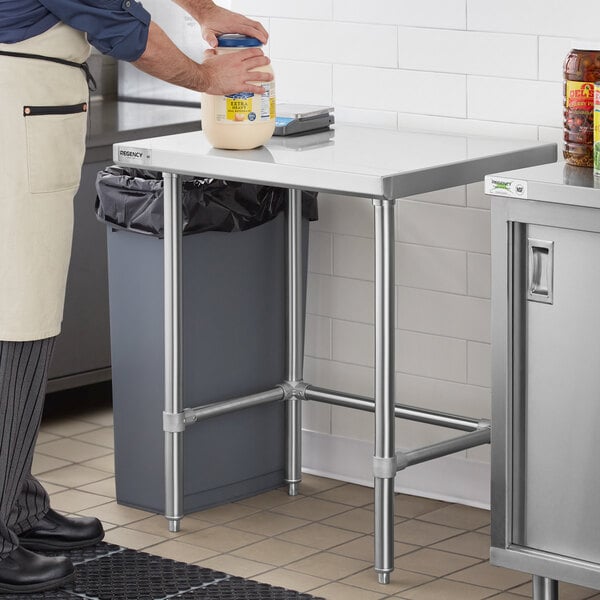 A Regency stainless steel open base work table in a kitchen.