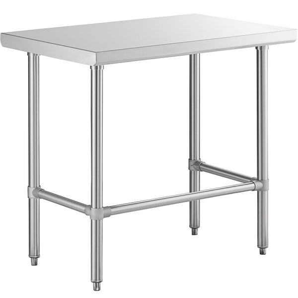 A Regency stainless steel open base work table with metal legs.