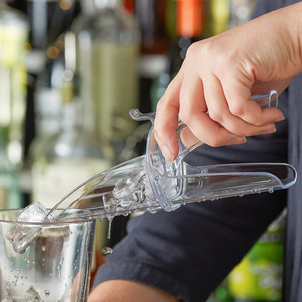 a spoon in a glass of water