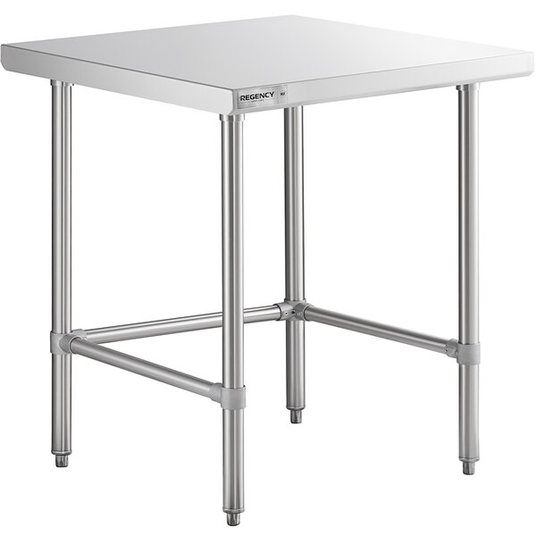 A Regency stainless steel work table with a square top on metal legs.