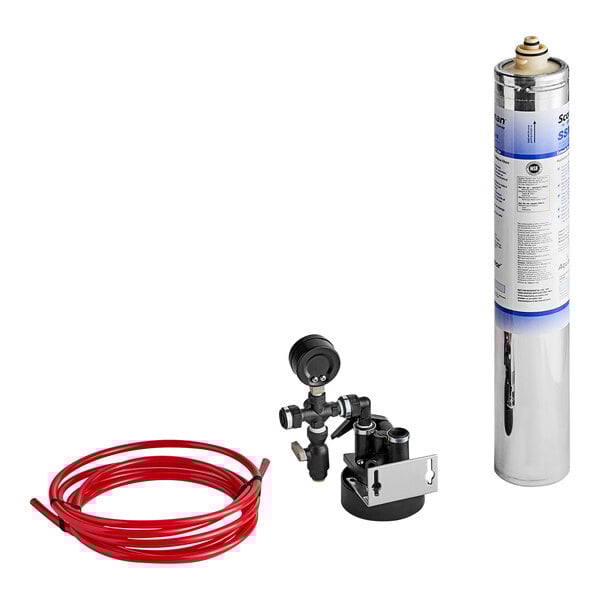A Scotsman SSM Plus water filtration system with a hose attached to a can.