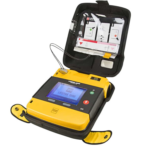 A Physio-Control LIFEPAK 1000 AED with a yellow and black device with a screen.