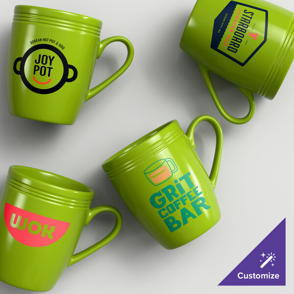 A set of four green stoneware mugs with different custom printed designs on each mug.