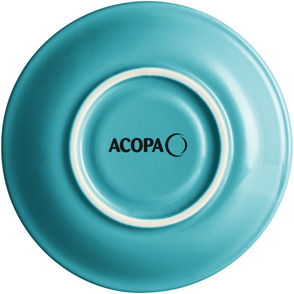 A Caribbean turquoise stoneware saucer with a white rim and black text that reads "Acopa" on it.