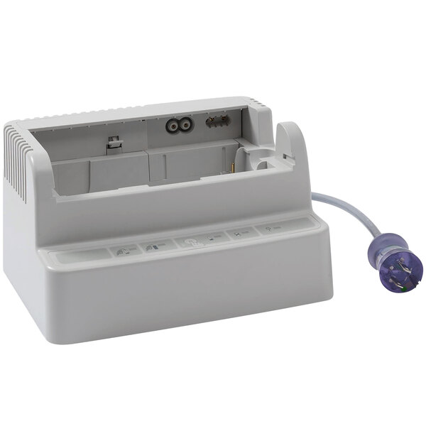 A white rectangular Zoll Single Bay Charging Station with a cord attached.