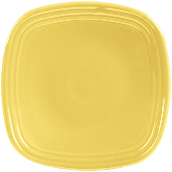 A yellow square Fiesta salad plate with a yellow circle in the middle.