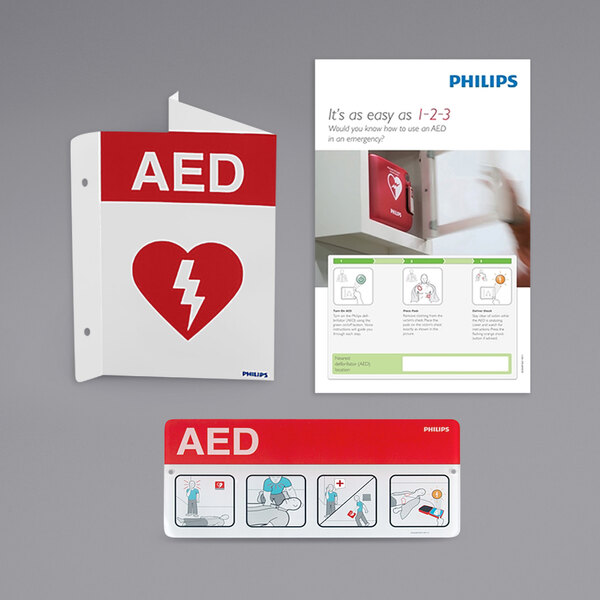 A red and white rectangular sign with a heart and white text that reads "AED Awareness" and a red lightning bolt.