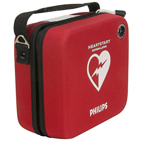 A white Philips semi-rigid case for a HeartStart OnSite AED with a red first aid kit inside.