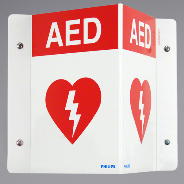 A white rectangular sign with red and white text reading "AED" and a white lightning bolt.