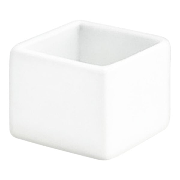 A small white square porcelain ramekin.